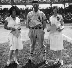 whataboutbobbed:  St Louis Cardinals pitcher Grover Cleveland Alexander poses before a game in Sportsmans Park in St Louis, flanked by two flappers promoting a health charity.  photo by Mark Rucker, 1927 