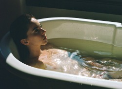 creativerehab:  Kacie in the Nomad bath #3. Lo-res 120 film scan. 