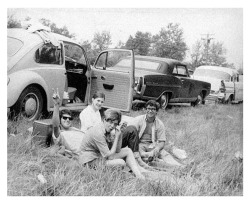 August 15, 1969: The Woodstock Music &amp; Art Fair opens in Bethel, NY. Photo: a group of friends have a picnic near the festival grounds (The Three Lions)