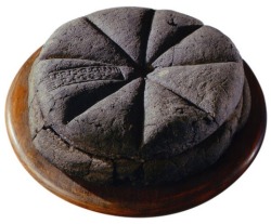 dancingspirals:  ironychan:  hungrylikethewolfie:  dduane:  wine-loving-vagabond-blog: A loaf of bread made in the first century AD, which was discovered at Pompeii, preserved for centuries in the volcanic ashes of Mount Vesuvius. The markings visible