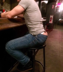 You were in a giant gay bar with your giant friend tom. You were only about two inches tall compared to them. You were teasing each other when you spotted a muscular hunk with his glorious ass hanging out of his jeans. Tom grins and picks you up, walking