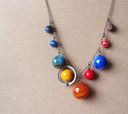 wickedclothes:  Solar System Necklace Mercury, Venus, Earth, Mars, Jupiter, Saturn, Uranus, Neptune, and Pluto are all included in this solar system necklace. Don’t hold the whole world in your hands. Hold the entire solar system around your neck. Hung