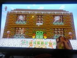 Shitty quality pictures of the Festive Texture pack since I don&rsquo;t know how to screenshot on the Xbox One. The lollipops and wreaths and the icicles on the roof are paintings! And instead of vines, there&rsquo;s lights hanging from the trees!