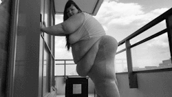suchafatash:  And this is what shaking your belly on a balcony looks like. Also at one million pounds.  http://www.clips4sale.com/48701   Hang for inches and jiggles for days&hellip; Big Cutie Ash 			D 			5'7&quot; 			583  /- 			 			203 			BMI: 70.2