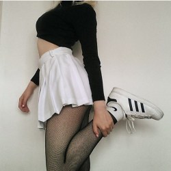 ericrohn:  Another shot of @romyhoskin’s ◼️◻️ monochrome outfit with a black crop top, black fishnet tights and a White American Apparel Tennis Skirt and matching black and white tennis shoes. #AATennisSkirt #TennisSkirt #WhiteTennisSkirt #americanapparel