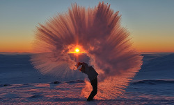 zooophagous:  elegantbuffalo:  Ontario-based photographer Michael Davies timed this impressive shot of his friend Markus hurling a thermos of hot tea through the air yesterday in -40°C weather near Pangnirtung in Canada’s High Arctic.  the most elegant