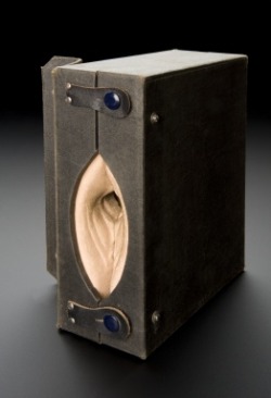 &lsquo;Gynaeplaque&rsquo; model, United States, 1925-1935. Medical professionals were taught how to insert a cervical cap using this model. The model is spongy rubber in a black case which opens to show the female reproductive organs. A cervical cap is