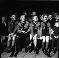 bdm-88:  Young Hitler Youth boys watch a Puppet show. 