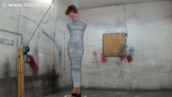 lets-webound:  I am asked all the time to make more  tape clips. I bought a bunch of rolls today and figured it was time. I  start this clip with The lovely Nichole,  very simply taped to my post. A cinder block under her high heeled  feet. I take my