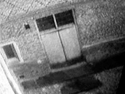 unexplained-events:  December 2003 this image was caught by the security cameras at Hampton Court Palace, a huge tudor castle near London. They kept finding the fire door open even when no one was there.  Upon viewing the footage they found this ghostly