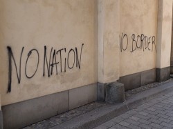 schwabbeli:  dasbisschentotschlag:  &ldquo;No Nation! No Border!&rdquo; Berlin, Brandenburger Tor, 18.12.2013.  fight law and order