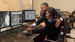 Obama Gently Guides Michelle’s Hand As She Maneuvers Drone Joystick    