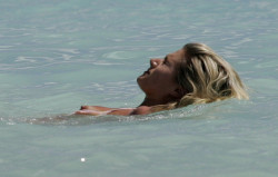 toplessbeachcelebs:  Sarah Jayne Dunn (British Actress) bikini slip in Barbados (December 2004) 