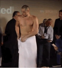 notdbd:  Boxer BJ Flores (a former BYU football player and Mormon missionary) weighs in nude before his match with Tony Bellew, and the cameras catch his penis as he adjusts his towel.  