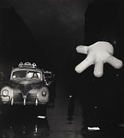 Weegee - Woman Cab Driver and Macy’s Clown, ca. 1942-1943.