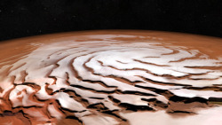 astronomyblog:    The Spiral North Pole of Mars      A  mosaic from ESA’s Mars Express   and by the Mars Orbiter Camera on board the Mars Global Surveyor   shows off the Red Planet’s north polar ice cap and its distinctive dark spiralling troughs.