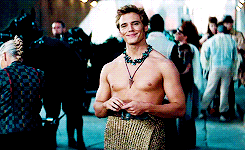 finnickodairheis:  Finnick Odair is something of a living legend in Panem. […] Tall, athletic, with golden skin and bronze-colored hair and those incredible eyes. 