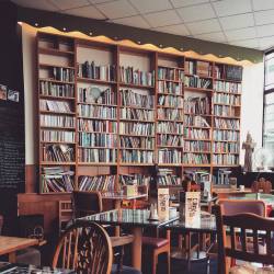 booksandpublishing:  Meet my favourite bookish wall. £1.50 for paperbacks and £2.00 for hardback. Books are also available for borrowing. Mean tea and cakes too! Black Book Café, Stroud.  