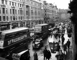 onlyoldphotography:  Carl Mydans: Scene on Regent Street on rainy day, heavy traffic and scattered groups of shoppers. Southern Wales, 1954 