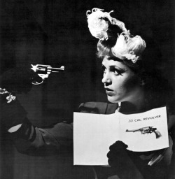 Eliot Elisofon - Judy Holliday boning up on use of guns in scene from film Adam’s Rib, Hollywood, 1949.