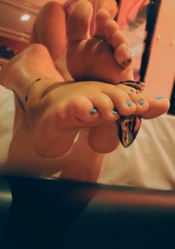 mr-boss-fetish:  Buttplug hanging between her toes. You know where it was before. 