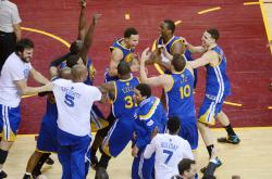 nba:    The Golden State Warriors celebrate after winning the 2015 NBA Finals in Game Six against the Cleveland Cavaliers at the Quicken Loans Arena on June 16, 2015 in Cleveland, Ohio(Photo by Garrett Ellwood/NBAE via Getty Images)  