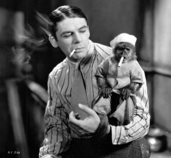 Paul Muni and his little friend in a shot from Scarface, 1932.