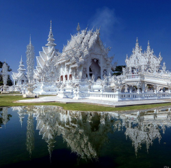 amitrips:  Wat Rong Khun, Thailand. Wat Rong Khun, perhaps better known to foreigners as the White Temple, is a contemporary, unconventional, privately owned, art exhibit in the style of a Buddhist temple in Chiang Rai Province, Thailand. It is owned