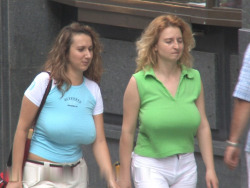 funbaggery:  I still can’t believe this candid clip. Two women possibly sisters with huge bouncy boobs walking in tandem braless. Is it their family culture to go commando?