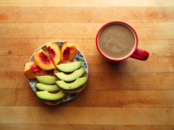 garden-of-vegan:  quartered yellow peach, a toasted whole wheat english muffin topped with sliced avocado, and coffee with soy milk.
