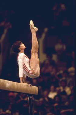 historicaltimes:  Nadia Comaneci performs on the balance beam during the 1976 Olympics. via reddit 