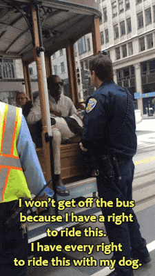 heylookitsarevolution:  ghettablasta:    Cop forces disabled Black man to get off the cable car (run by SFMTA) because the driver is afraid of his pitbull service dog.   In a viral video shared by San Francisco resident and attorney Gina Tomaselli, a