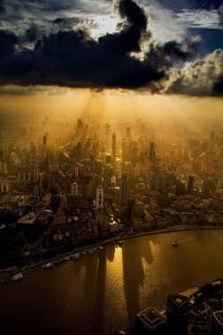 enochliew:  Photographed by Wei Gensheng Taken from a crane while he is currently working on the construction of the Shanghai Tower.