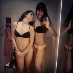sexywithorwithout:  Two girls trying on matching underwear in the fitting room.Â 
