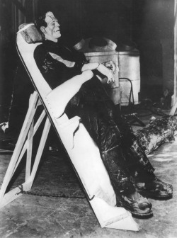 universalmonsterstribute:  Boris Karloff taking a break on the set of The Bride of Frankenstein (1935) 
