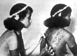 Papua New Guinean   women tattooing. Via collection of old photos.