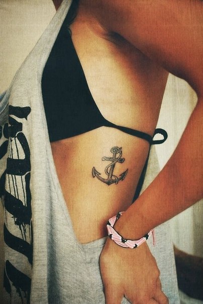 Anchor tattoo love conquers all