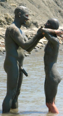 mixedgendernudity:  Nudist couple plays with mud while being naked. Someone needed some extra mud…