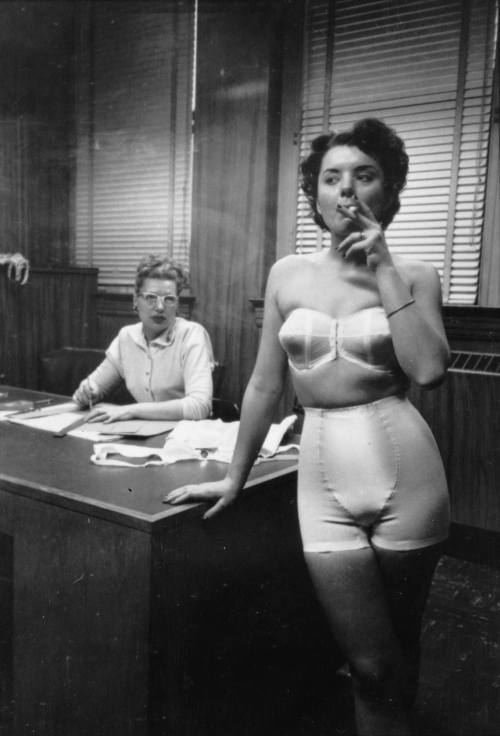 Stanley Kubrick - In Chicago, a lingerie model takes a smoke break while behind the scenes at a fashion show. Nudes &amp; Noises  