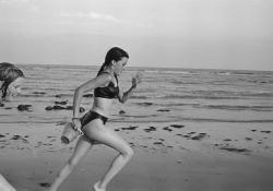  Peter Marlow GB. East Sussex, Pett Level. Chloe MARLOW and a friend running on the beach. 1995. 