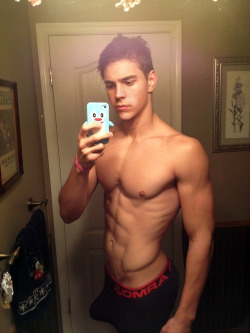 just-a-twink:  hotsouls:  cute boy with a boner!  Awesome Torso, Hot Bulge  and that phone case