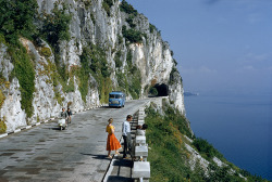 natgeofound:  Motorists pass people on a scenic road atop a cliff overlooking a bay near Trieste, Italy, 1956.Photograph by B. Anthony Stewart, National Geographic Creative 