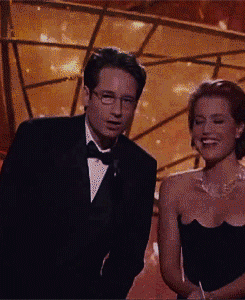 tracylord:  David Duchovny and Gillian Anderson fooling around  presenting Best Actor in a TV Series Comedy&gt; in 1998 [x]