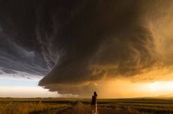 yahoonews:  Beauty and the beast A man has photographed a stunning set of images of beauty and the beast - as his pretty wife poses in front of epic storms. Nicolaus Wegner, 34, snaps other half Daow, 32, dangerously close to tornadoes and lightning storm