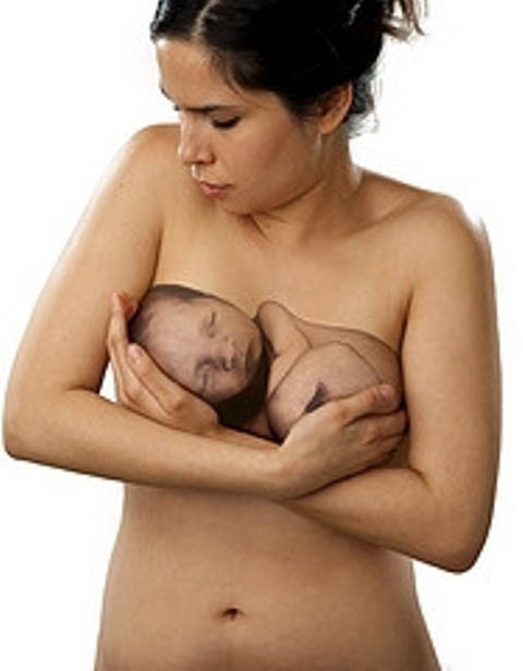 Black mother breastfeeding baby