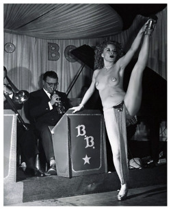 burleskateer:  In a vintage 50’s-era photo,— Pat &ldquo;Amber&rdquo; Halladay displays a leg kick during a performance at an unidentified nightclub.. 