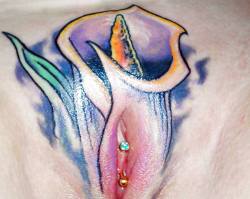 VCH piercing with a pussy framing tattoo that is a welcome change from the usual butterfly, a lily.