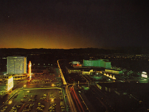 vintagelasvegas:  View from the original MGM Grand, c. 1975Looking west over Las Vegas Blvd and Flamingo Road. Caesars Palace’s new sports pavilion is behind the hotel. Lower right, darkened Times Square Motel, closed in ‘74. Postcard from Las Vegas