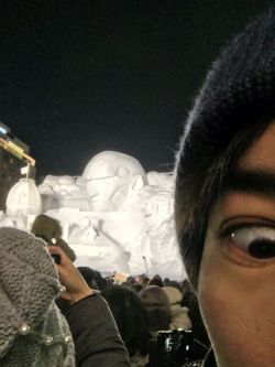 Isayama Hajime shares a selfie in front of the Colossal Titan + Rogue Titan snow sculptures at the Sapporo Snow Festival!