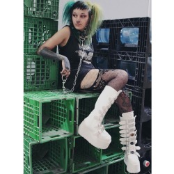 pleaserusa:When ppl tell you to wear less black, but you extra🖕😂🖕. 3” platform #Demonia Damned-318 boots in white vegan leather are a middle finger to all tha haters. Also snag these knee high metal plated buckle boots in black holo, black